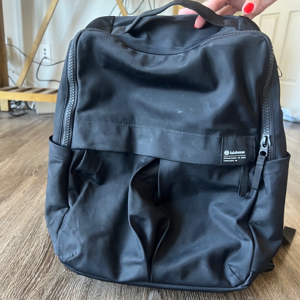 Lululemon Backpack with 3 zipper pockets and 2 side pockets